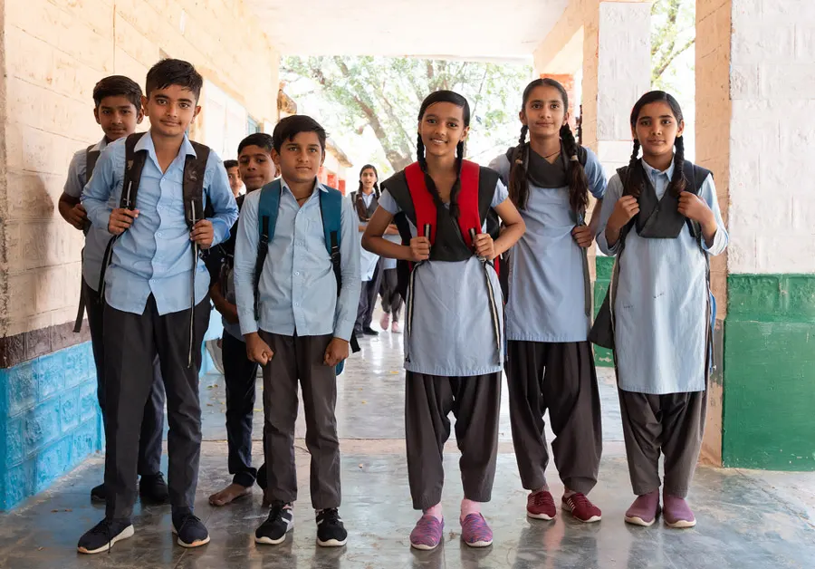 Children in a school setting supported by education initiatives